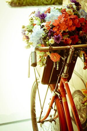 Vintage bicycle with flower - vintage effect filter style picturesの写真素材