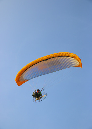 Paraglider on blue bright skyの写真素材