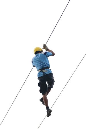 Muscled man on zip line on white backgroundの写真素材