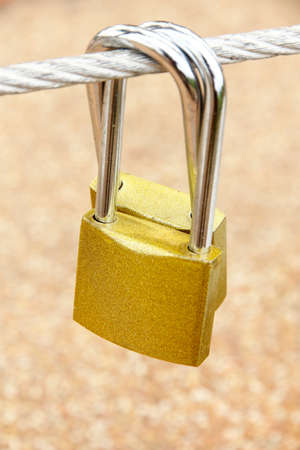 Two hanging golden padlocks