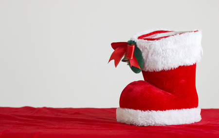 Red Santa's boot with copyspace isolated on white backgroundの写真素材