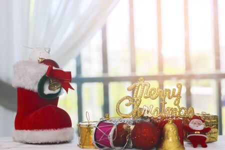 A Red Tag with a White Merry Christmas on It as Christmas Backgroundの写真素材