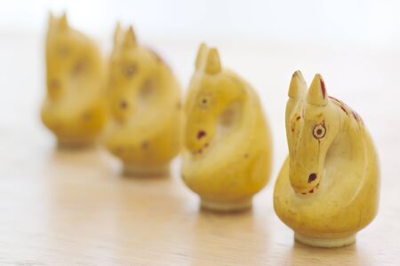 Close up of chess pieces on the board, shallow depth of field