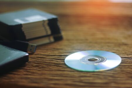different computer storage devices for data and information including a CD-DVD, floppy disc, USB key, compact flash cardの写真素材