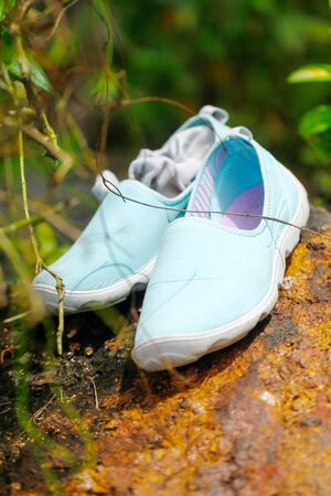 Blue shoes on mountain landscapeの写真素材