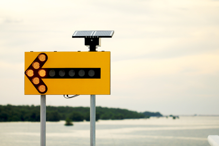 Road sign with solar cell, as Nature Background.の写真素材