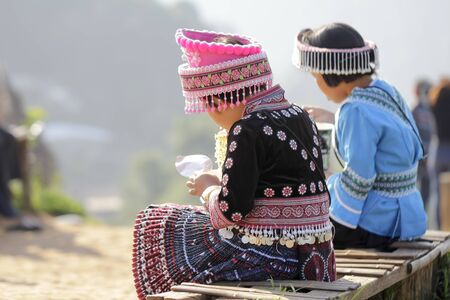 Back view of young girl hmong hill tribe in beautiful costume dress in Thailand.の写真素材