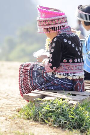 Back view of young girl hmong hill tribe in beautiful costume dress in Thailand.の写真素材