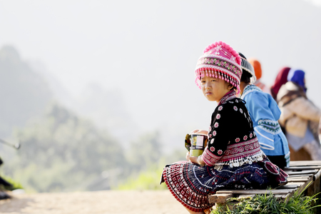 Back view of young girl hmong hill tribe in beautiful costume dress in Thailand.のeditorial素材