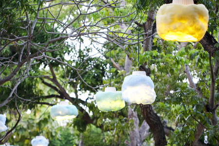 Night ceremony with a lot of vintage lamps on big treeの写真素材