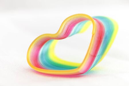 rainbow colorful lines crossing each other on heart shapeの写真素材