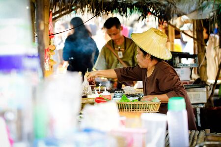 Suphan Buri, Thailand - Janurary, 13, 2018 : Unidentified name old woman sell thai style at samchuk...
