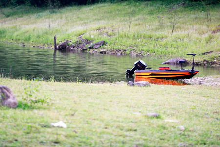 boat on the lake, lake and mountains in summer. forest on backgroundの写真素材