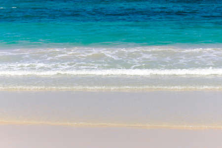 Soft beautiful ocean wave on sandy beach. Background.