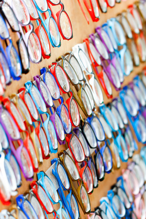 Closeup colorful eyeglasses hanging on shop show  for customer select.の写真素材
