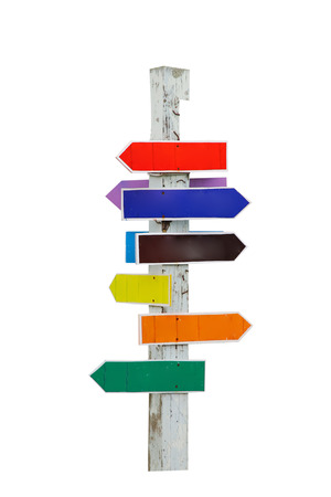 Painted directional wood signs over a blue skyの写真素材