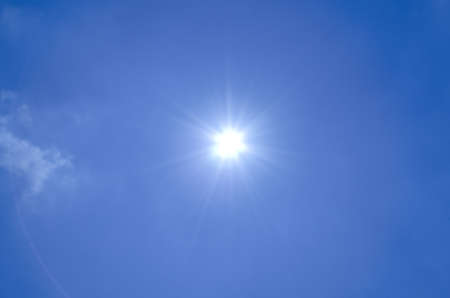 Blue sky background with sunlightの写真素材