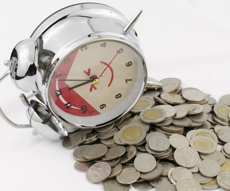 Beautiful clock staying on Baht coins.の写真素材