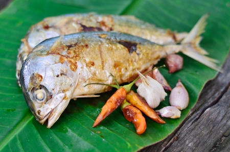 Fish grilled on a banana leaf backgroundの写真素材