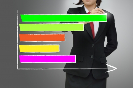 Business woman drawing growing graphの写真素材