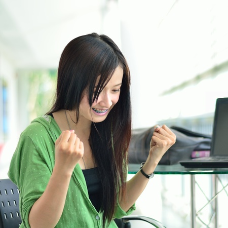 Asian girl smiling in success jobの写真素材