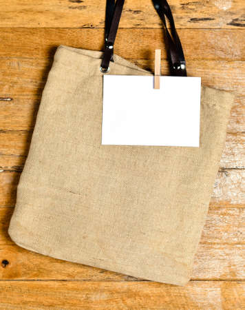 shopping bag on old wooden background for natural recycle conceptの写真素材