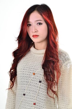 Asian women with red color long hair in modern lifestyle fashionの写真素材