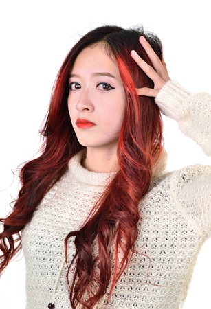 Asian women with red color long hair in modern lifestyle fashionの写真素材