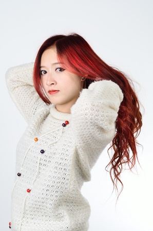 Asian women with red color long hair in modern lifestyle fashionの写真素材