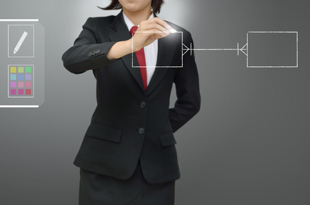 business woman drawing entity relation diagram  ERD  and Database designの写真素材