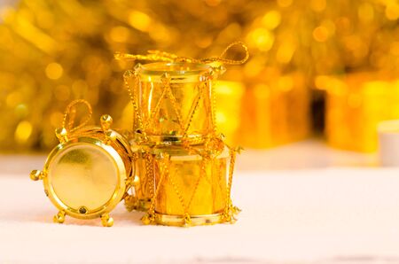 christmas scene and new year background for art design with golden drum, snow gold bokeh backgroundの写真素材