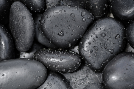 Close up spa stones with water drop for background designの写真素材