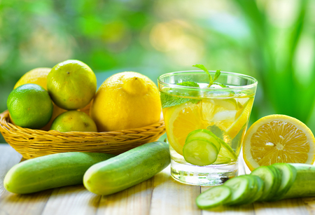 Detox water drink with lemon and cucumber in glassの写真素材