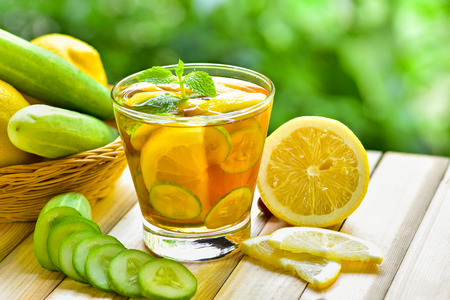 Tilt shot for glass of detox water drink with lemon and cucumberの写真素材