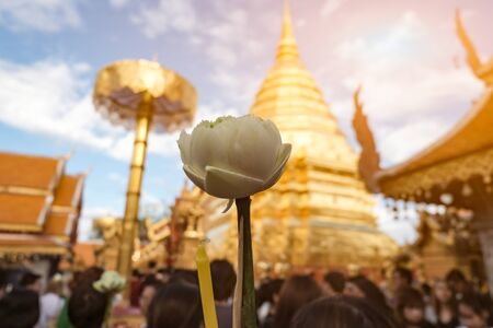 Lotus incense, candles, for respect for blessings Golden Chedi containing Buddha's relics as believed by Buddhists at Wat Phra That Doi Suthep in Chiang Mai, Thailandの写真素材