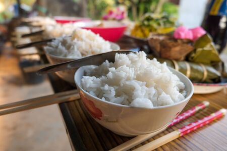 Cooked rice and food for use as offerings to ancestors in the Chinese New Year festivalの写真素材