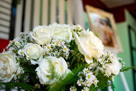 White rose bouquet decorated in the weddingの写真素材