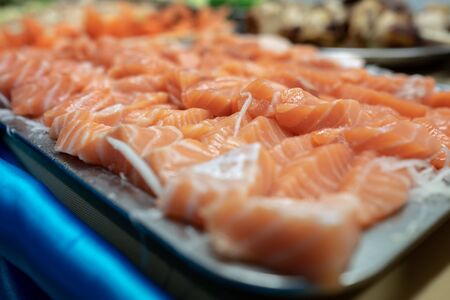 à¹Japanese-food , Sliced ââsalmon sashimi Placed in a container on the tableの写真素材