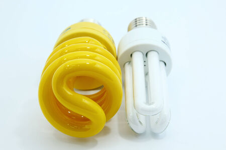 Energy saving yellow fluorescent light bulb   Isolated on white 