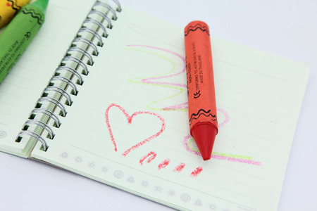 Crayons in different colors on white background の写真素材