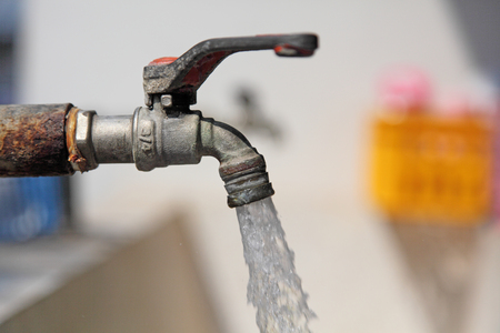 the flowing water on tap の写真素材