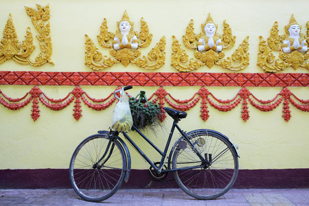 Bicycle parking beside the temple wallの写真素材