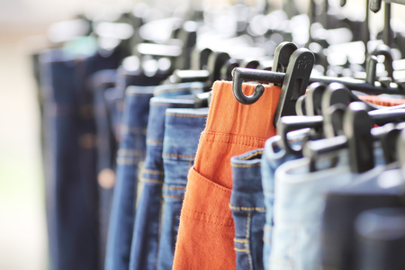 a lot of womens jeans at a store の写真素材