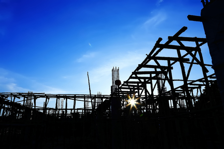 Silhouettes of Construction site on sky background