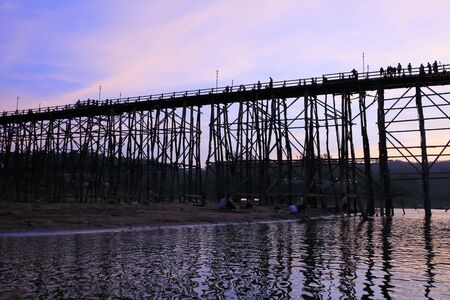 Wooden Mon Bridge during sunset, Sangkhla Buri,Kanchanaburi province, Thailandの写真素材