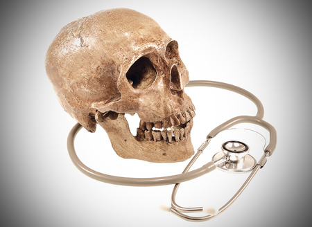Medical concept, weathered human skull and stethoscope. vintage style.の写真素材
