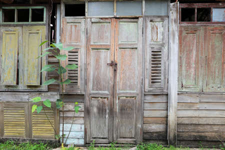 Tropical wooden house wall with door and windowの写真素材