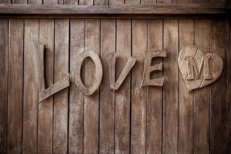 Old word Love with wooden on old wood background.vintage styleの写真素材