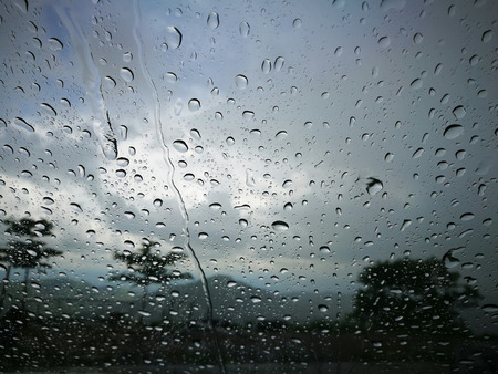 Blurred rain drop on the car glass backgroundの写真素材