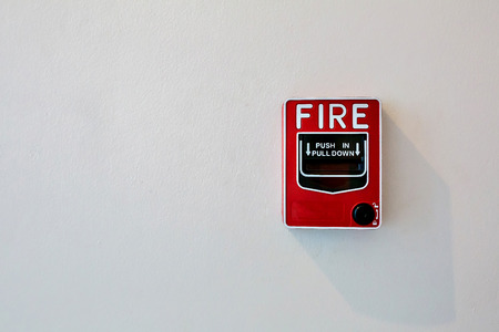 Fire alarm switch on white wallの写真素材